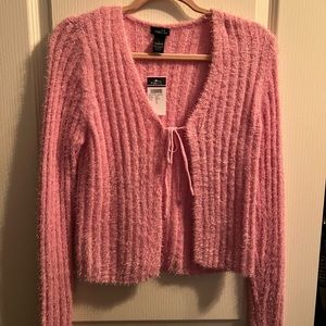 pink tied sweater